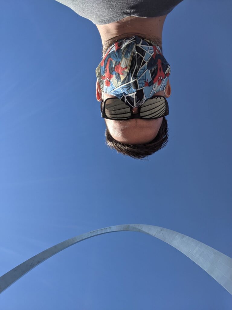 Looking up at the arch and Alex sticking his head in to the frame