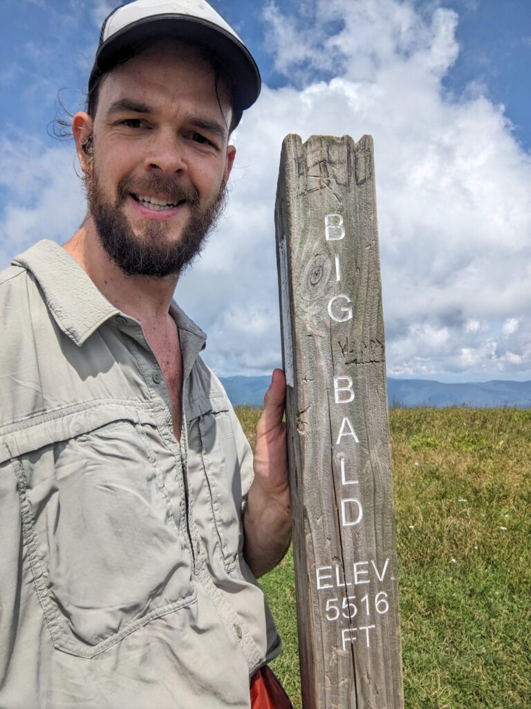 Me at the Big Bald Summit sign